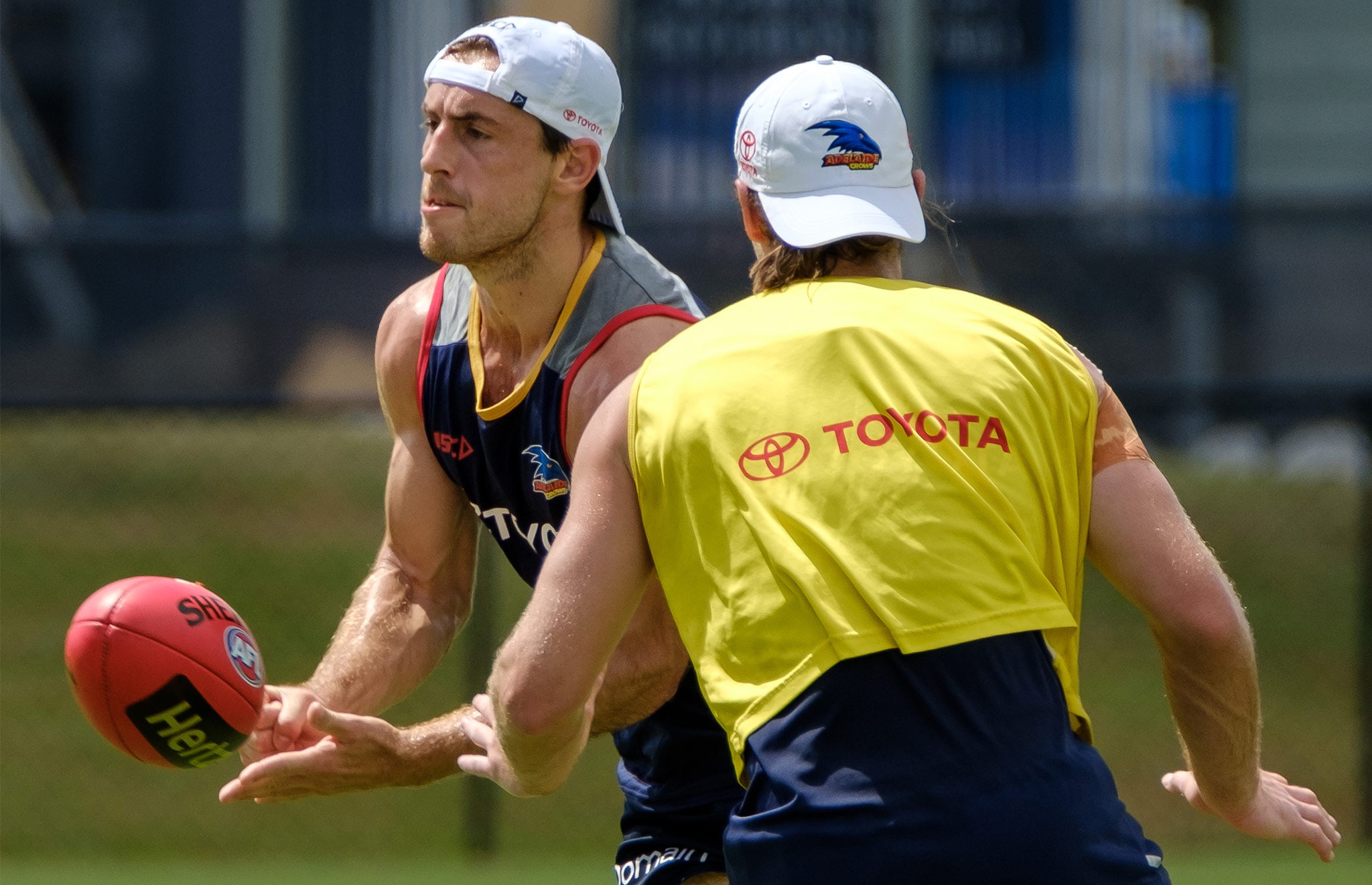 douglas-richard-300THM.jpg Richard Douglas fires out a handball at Adelaide's training camp on the Gold Coast - AFL,Adelaide Crows,Bryce Gibbs,Richard Douglas,Brodie Smith,Hugh Greenwood